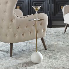 an elegant chair with a martini glass on it