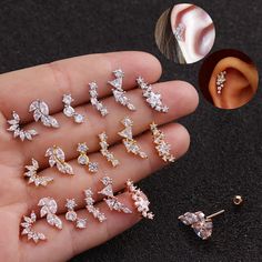 six pairs of ear studs with different shapes and sizes in each one, including the top