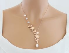 "Our gold orchid and pearl necklace is stunning!! This gorgeous necklace is the perfect bridesmaids gift or wedding jewelry for the bride. You will turn heads when you walk down the isle wearing this orchid necklace. Featuring six cascading orchids accented by three beautiful freshwater pearls along the side of the chain. To finish off this beautiful necklace a freshwater pearl drips from the bottom orchid. M A T E R I A L S * Gold Plated, Silver Plated or Rose Gold Plated Orchids * Dainty Fresh Wedding Necklace Gold, Orchid Necklace, Gold Orchid, Bridal Pearl Necklace, Pearl Necklace Wedding, Y Necklace, Pearl Bridal, Necklace Wedding, Necklace Pearl