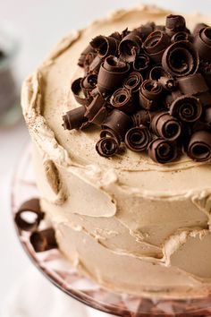 there is a cake that has chocolate curls on it