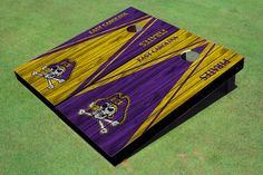 a purple and yellow cornhole game board