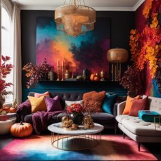 a living room filled with lots of furniture and colorful decorations on the wall behind it