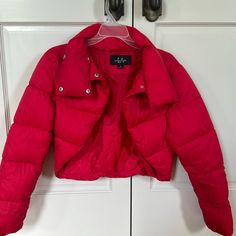 This Red Cropped Puffer Vest Is Basically Brand New Having Only Been Worn Once. It Includes A Unique Scooped Cut In The Front. Size M But Would Definitely Fit A Small As Well Red Casual Puffer Jacket For Spring, Fitted Red Outerwear For Cold Weather, Trendy Red Fitted Outerwear, Red Cropped Outerwear For Spring, Red Puffer Jacket For Spring, Red Fitted Cropped Jacket For Spring, Fitted Red Cropped Jacket For Spring, Red Cropped Puffer Jacket Outfit, Fitted Red Puffer Jacket For Winter