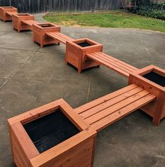 several wooden benches sitting on top of cement