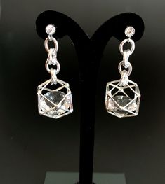 Unusual, sparkly diamond shaped crystals are captured in silver plated cages. I have joined them to the crystal, non allergenic, stainless steel posts with chain maille. Nice neutral earrings will go with anything. Makes a lovely gift. Here is a link to my whole shop: https://www.etsy.com/shop/designsbymalone RETURNS - BUY WITH CONFIDENCE Don't worry, I will refund or exchange an item up to 60 days. Makes gift giving easy! All my items will arrive in a gift box and/or a velvet or organza pouch. Sparkling Stone Metal Earrings For Gift, Silver Crystal Earrings With Diamond Accents For Party, Nickel-free Crystal Earrings For Formal Occasions, Silver Crystal Earrings With Diamond Accents For Evening, Formal Nickel-free Crystal Earrings, Party Earrings With Clear Metal, Metal Drop Crystal Earrings For Anniversary, Pierced Metal Crystal Earrings For Anniversary, Silver Crystal Earrings With Sparkling Stones For Gift