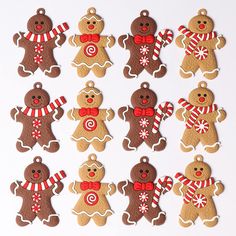 twelve gingerbread cutouts with candy on them