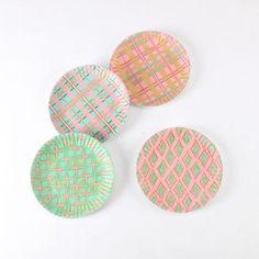 three paper plates with different patterns on them