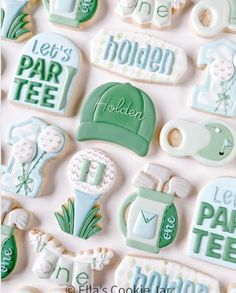 decorated cookies are arranged in the shape of golf related items, including hats and tees