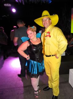 a man and woman dressed up in costumes