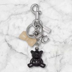 Brand New Silver Bow And Bear Bag Charm From Coach. Dust Bag Included. Coach Silver Bags For Gifts, Bear Bag, Silver Bow, Coach Accessories, Rectangle Shape, Black Silver, Fashion Bags, Dust Bag, Gift Box