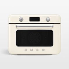 a white oven with the door open on a gray background and an eme logo above it