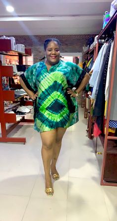 This casual and comfortable dress is made from 100% African Adire Silk. This shift Kaftan Dashiki dress is super comfortable, chic & sweet. Can be worn as a formal dress with heels or as a casual dress with sneakers or sandals.  DETAILS  -Short Sleeve   - Height of Model ; 5ft5 inches -Length of Dress : 36 inches  -It has a shift dress silhouette. -Has 2 side pockets  -Shimmery fabric added to pockets as accent  PROCESSING & SHIPPING  -Because all outfits are handmade from a scratch , please allow 5-7 business days for processing. -Shipping is by DHL / UPS Express International which takes 5-8 business days. So allow 10-15 business days to receive your order.  WHOLESALE  We offer wholesale pricing with an moq of 15 pieces. Reach out to us let's discuss.  SOURCING FROM NIGRIA We are also ab Casual Dress With Sneakers, African Tie Dye, Plus Size African, Shimmery Fabric, Dashiki Dress, Gown Plus Size, Comfortable Chic, Dye Dress, Party Gown