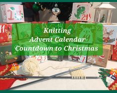 knitting kit sitting on top of a table next to christmas presents and other items with the words knitting advent calendar countdown to christmas