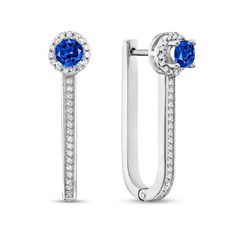 Find a fresh new look with the modern design of these blue sapphire and diamond frame U-hoop earrings in white gold. Created in cool 10K white gold Each narrow "U"-shaped hoop shimmers with a row of diamonds punctuated in a 3.75mm round bright blue sapphire post. A diamond-lined halo frame completes the sparkling look. These 1/4 ct. t.w. diamond earrings secure with hinged backs. Diamond Frame, Earring Jewelry, Bright Blue, Blue Sapphire, New Look, Halo, Diamond Earrings, Modern Design, Sapphire