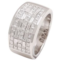 18kt White Gold Dome Ring With Square and Baguette Cut Diamonds Diamonds: 40 Square cut diamonds, 10 baguette cut Diamonds Material: 18kt white gold Total weight: 15.2 gram / 0.535 oz / 9.7 dwt Ring size: 55 EU / 7.25 US ( Can Be Resized For Free) Gold Dome Ring, Pink Gold Rings, Cognac Diamonds, Dome Ring, Diamond Free, Baguette Cut Diamond, Modern Ring, Domed Ring, Square Cut