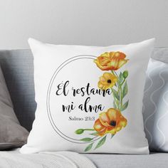 a white pillow with yellow flowers and the words, el restanoo mi alma