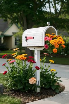 a mailbox with flowers growing out of it