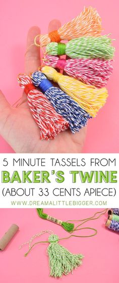 a hand holding some colorful tassels with the words 5 minute tassels from baker's twine about 3 cents