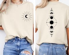 Moon Phases Shirt, Celestial Shirt, Aesthetic Clothing, Women's Clothes, Moon Shirt, Eclipse Shirt, Aesthetic Moon Shirt, Sky Shirt, Moon GILDAN product features 50% cotton/50% polyester Heather Sport 60P/40C Safety Green is ANSI/ISEA 107 compliant 20/1 Double-needle stitching at shoulder, armhole, neck, waistband and cuffs 1x1 rib with spandex Air jet yarn for softer feel and reduced pilling Tear away label How Do I Order 1- Please review all the information provided before placing an order 2- Select the shirt type and size using the drop down menu.  3- Select the color of the shirt using the following drop down menu. 4- Please add the vinyl color (white or black) in the optional message section of the order. 5- Need more Items? Add the current item in the cart. And If you like to add mor Moon T-shirt, Moon Phase Shirt, Trendy Cotton T-shirt With Moon Print, Moon Tshirt, Mystical Moon Shirt, Moon Phases Shirt, Black Cotton T-shirt With Moon Print, Moon Shirt, Moon Phases