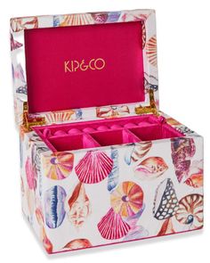 a pink box with shells on it and the lid opened to show its contents inside