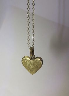 Beautiful Hammered Heart Pendant Necklace. Handmade in brass, with a hammered sand texture finish. This necklace is a perfect addition to your jewellery collection and the perfect gift for your loved one! Chain Lenght: 45,7cm  / 18 in Pendant Size: 1,8 cm x 1,8 cm Pendant Thickness:  3 mm Material: Brass Finish: Hammered with sand texture. The Heart Pendant is available to purchase separately without a chain. The pendant is also available in mini-size. Measurements for the Mini Heart Pendant: Pe Gold Heart-shaped Brass Necklace, Dainty Heart-shaped Brass Necklaces, Brass Heart Necklace For Anniversary, Bronze Heart Necklaces For Valentine's Day, Heart-shaped Brass Necklace For Anniversary, Bronze Heart-shaped Necklace For Valentine's Day, Heart-shaped Yellow Gold Brass Necklace, Heart Shaped Yellow Gold Brass Necklace, Yellow Gold Heart-shaped Brass Necklace