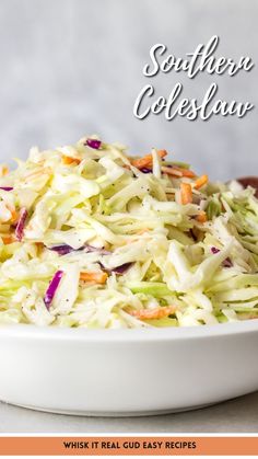 a white bowl filled with coleslaw on top of a table