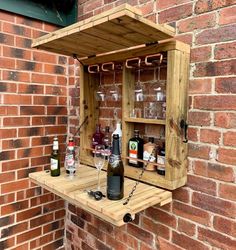 a wooden shelf with bottles and glasses on it