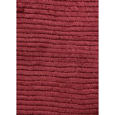 a close up view of the texture of a red rug