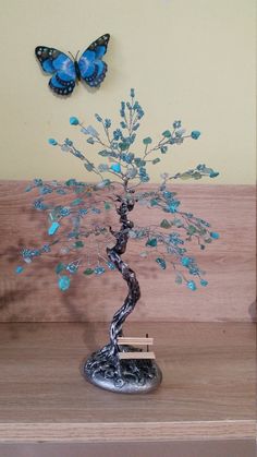 Gemstone tree made with natural turquoise,blue-green agate,blue beads,wire,acrylic paints,base stone from Black sea coast with the energy of the sea. This tree means love,partnership,friendship,strong connection. Size 25 sm (9,84 inches). ♥ Purification ♥ Serenity ♥ Protection ♥ Wisdom ♥ Balance ♥ Strength ♥ Friendship ♥ Love ♥ Positive thinking ♥ Sensitivity Turquoise is a purification stone. It dispels negative energy and can be worn to protect against outside influences or pollutants in the a Display Crystals And Stones, Feng Shui Tree, Beaded Trees, Gemstone Tree, Wire Tree Sculpture, Wire Trees, Friendship Symbols, Creative Problem Solving, Wire Tree