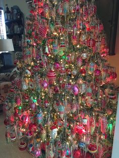 a christmas tree with many ornaments on it