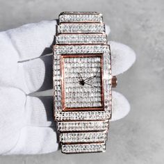 Step into elegance with this fully iced-out diamond timepiece that mirrors genuine luxury watches. We utilize premium simulated diamonds crafted from high-refractive crystals, ensuring a sparkle that rivals authentic diamonds under the light! INCLUDES AN EASY-TO-USE SIZE ADJUSTMENT TOOL Specifications: - Gender: Men's  - Case Size: 40mm - Movement: Quartz Movement - Battery: Included - Sizing: 8.5-inch band - Adjustable: Links are removable to fit your wrist - Back: Stainless Steel - Lock: Deployment Clasp - Stone: VVS Diamond Simulate - Case Material: Alloy - Finish: Rose Gold Plating  Whether you're dressing up for casual days, or events, or gifting someone special on occasions like Graduations, Valentine's Day, Anniversaries, Birthdays, Thanksgiving, Christmas, New Year, or Father's Day Luxury Diamond Watch With Crystal Hour Markers, Luxury Crystal Diamond Watch With Diamond Hour Markers, Rectangular Diamond Watch As A Gift, Rectangular Diamond Watch As Gift, Rectangular Diamond Watch For Gifting, Luxury Rectangular Diamond Watch With Diamond Accents, Rectangle Watch, Vvs Diamond, Luxury Watches For Men