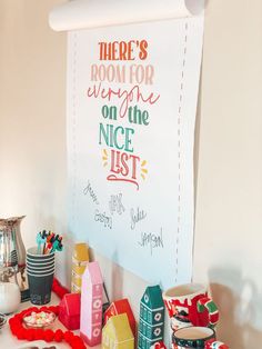 there's room for everyone on the nice list sign next to cups and mugs