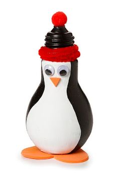 a penguin figurine with a red hat on it's head and eyes