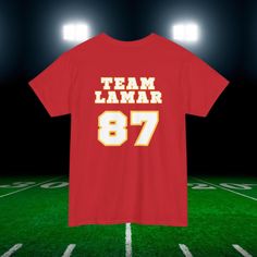 a t - shirt that says team lamar on it in front of a football field