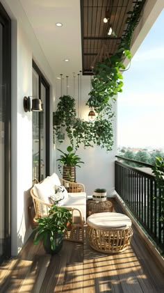 a balcony with wicker furniture and potted plants on the wall, along with wooden flooring