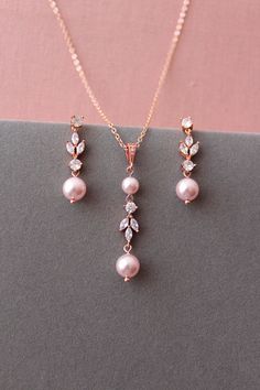 Elegant Pink Crystal Jewelry Sets, Elegant Pink Jewelry Sets For Formal Occasions, Elegant Rose Gold Necklace With Matching Earrings, Party Rose Gold Dangle Jewelry Sets, Rose Gold Jewelry Set With Elegant Design For Gifts, Elegant Pink Dangle Jewelry, Rose Gold Dangle Jewelry For Anniversary, Delicate Necklace With Matching Earrings For Formal Occasions, Delicate Matching Earrings For Party