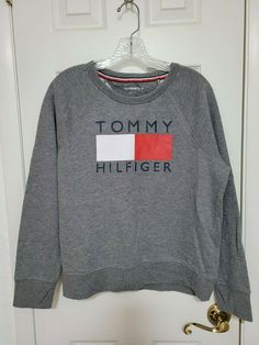 Up for sale is a Tommy Hilfiger Gray Sport Sweatshirt. Women's size Large. Chest measures 44 inches and Length is 23 1/2 inches. Any dark areas in the pictures are shadows from my cell phone. EUC, no stains, holes or tears. Please email me with any questions.     . Smoke-free home, but I do have cats.  To take advantage of combined shipping, please wait until I send you an invoice for all of your items before paying.  Items listed with free shipping are for continental United States only and do Casual Everyday Tommy Hilfiger Tops, Sporty Long Sleeve Tommy Hilfiger Sweatshirt, Tommy Hilfiger Long Sleeve Gray, Tommy Hilfiger Crewneck, Tommy Hilfiger Cotton Logo Print Sweatshirt, Cheap Sporty Tommy Hilfiger T-shirt, Cheap Tommy Hilfiger Sporty T-shirt, Tommy Hilfiger Long Sleeve Cotton T-shirt, Tommy Hilfiger Sweatshirt