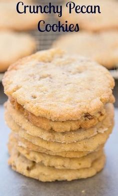 a stack of cookies sitting on top of a cooling rack with the words crunchy pecan cookies