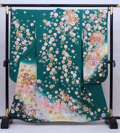 Cover yourself in a garden of flowers wearing this traditional Japanese silk Furisode kimono in teal green. Made of high quality silk threads. Beautiful to wear or as a room display. Item: Furisode Silk Kimono No. Syfu041 Size: US L-XL / Length 61 inch (155cm), Width 26 inch (67cm) Design : Floral Sakura cherry blossom. Condition: Used, Good. Please check the photos. Need a KIMONO RACK to hang this kimono? Find it here: https://www.etsy.com/listing/1303669853/kimono-rack-japanese-kimono-display- Kimono Display, Teal Kimono, Kimono Traditional, Furisode Kimono, Green Kimono, Kimono Floral, Wedding Kimono, Japanese Dress, Room Display