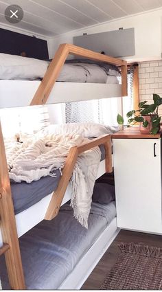 a bunk bed in a small room with white walls