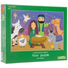 the christmas party floor puzzle is shown with animals and a manger scene on it