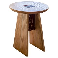 a small wooden table with a hole in the center on it's side and an opening at the top