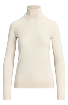 Silk-enriched yarns refine the fit and feel of this sweater knit with a slim, figure-skimming fit and finished with a tall turtleneck that keeps you warm as temperatures dip. Turtleneck Long sleeves with ribbed cuffs 42% modal, 33% silk, 25% recycled nylon Dry clean or machine wash, dry flat Imported Beige Fitted Turtleneck Sweater, Fitted Beige Turtleneck Sweater, Beige Fine Knit High Neck Sweater, Beige High Neck Fine Knit Sweater, Fitted Cream Turtleneck With Long Sleeves, Fitted Beige Knit Turtleneck, Cream Stretch Turtleneck Sweater, High Neck Cream Sweater With Stretch, Cream High Neck Stretch Sweater