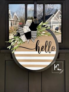 a door hanger that says hello on it