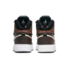 Introducing the Nike Womens Air Jordan 1 Acclimate Chocolate! This sneaker-boot hybrid is perfect for those cold winter days. The upper is made of brown and white leather, with rolled edges and a rubberized heel overlay. The lacing system includes speed hooks and D-ring eyelets. The quilted textile collar and tongue feature a faux fur lining. Above the white rubber midsole is a matching white rubber wrap. The brown cored-out rubber outsole provides grip and durability. Air Jordan 1 Acclimate, Womens Air Jordan 1, Womens Air Jordan, Wmns Air Jordan 1, Veja Sneakers, Womens Air Jordans, Adidas Spezial, Dunks Nike, Adidas Campus