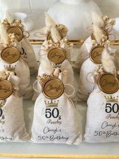 five bags with 50th birthday decorations on them