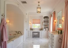 a large bathroom with marble floors and white walls, along with pink drapes on the windows