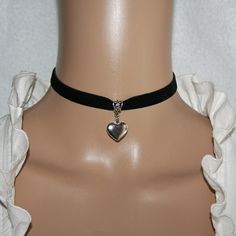 "Velvet choker, elastic, with a heart pendant. Velvet ribbon elastic black, 0.39\" wide  heart of stainless steel 0.55\" X 0.59\" carabiner clasp of stainless steel with extension chain This noble choker enhances every dirndl or traditional dress, ideal for the Oktoberfest Traditional wedding or other occasions." Chokers Black, Satin Choker Necklace, Heart Pendant Choker, Aesthetic Choker Necklace, 90s Choker Aesthetic, Choker Chain, Choker With Pendant, 2000s Choker, Choker Black