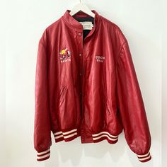 Vintage Red Leather Varsity Jacket “Coach Ryan” “Saints” Lined Button-Up Closure Embroidered Details Unisex (Men’s Xl) Condition: Great! Shoulder To Shoulder 22” Pit To Pit 21” Shoulder To Cuff 25” Bottom Width 19” Length Top Button To Bottom 26” #Vintagevarsity #Vintageleather #Sportjacket #Bomber #Redleather Casual Red Outerwear With Embroidered Logo, Casual Red Embroidered Outerwear, Vintage Red Embroidered Outerwear, Jacket Coach, Leather Varsity Jackets, Embroidered Details, Sports Jacket, Men's Coats And Jackets, Vintage Jacket