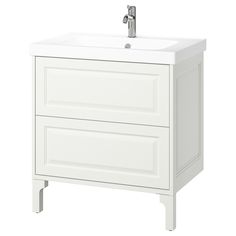 a white bathroom vanity with two drawers and a faucet on the sink side